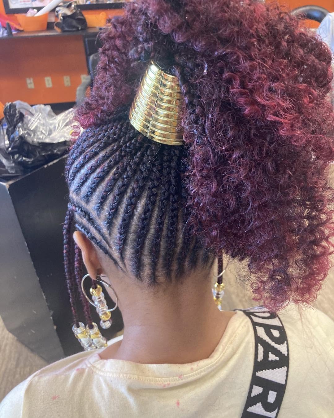 Braided updo finished with a gold cuff